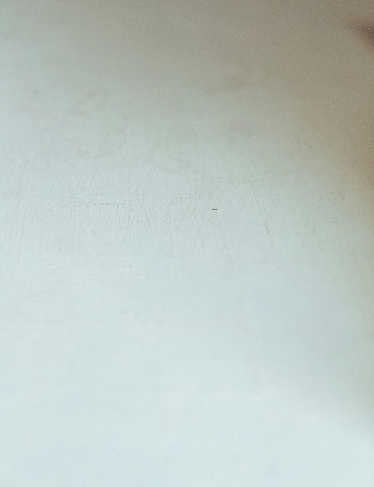 a close up of a snowboard on a white surface