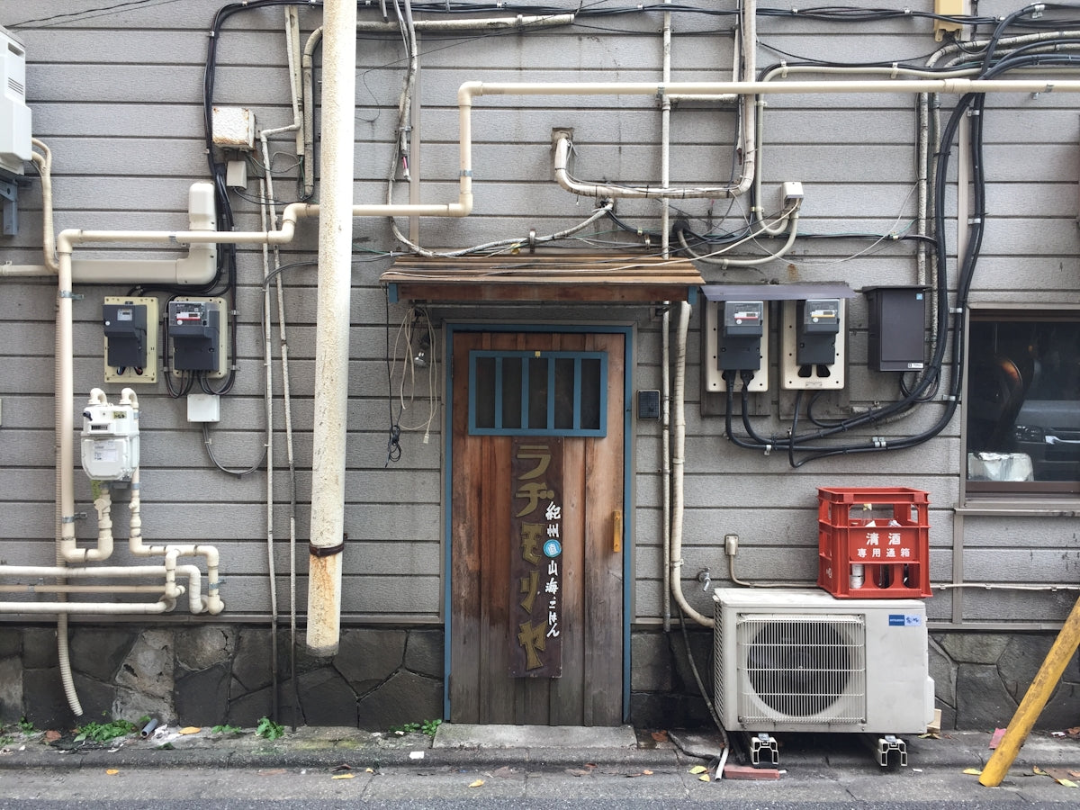 closed brown wooden door during daytime