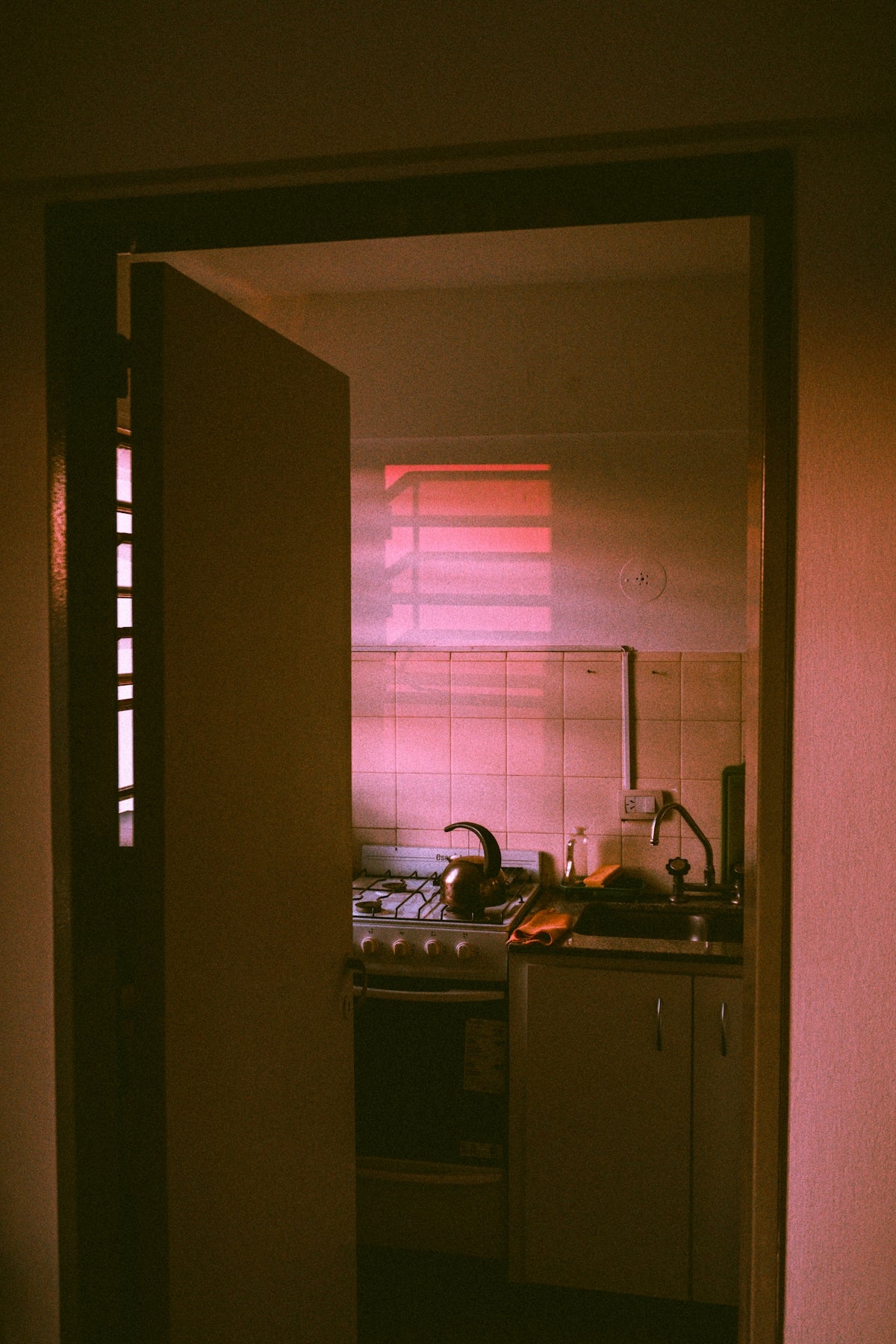 white window blinds near white gas range oven