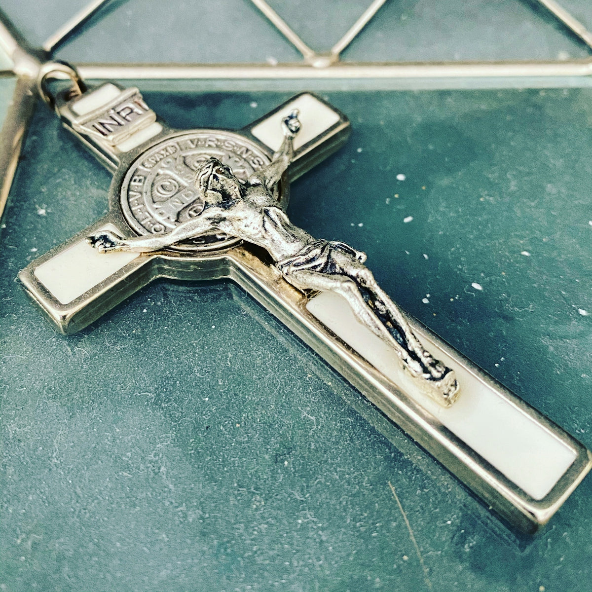 silver key on blue textile