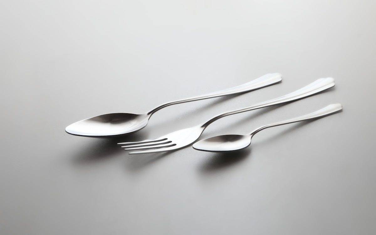a couple of forks and spoons on a table