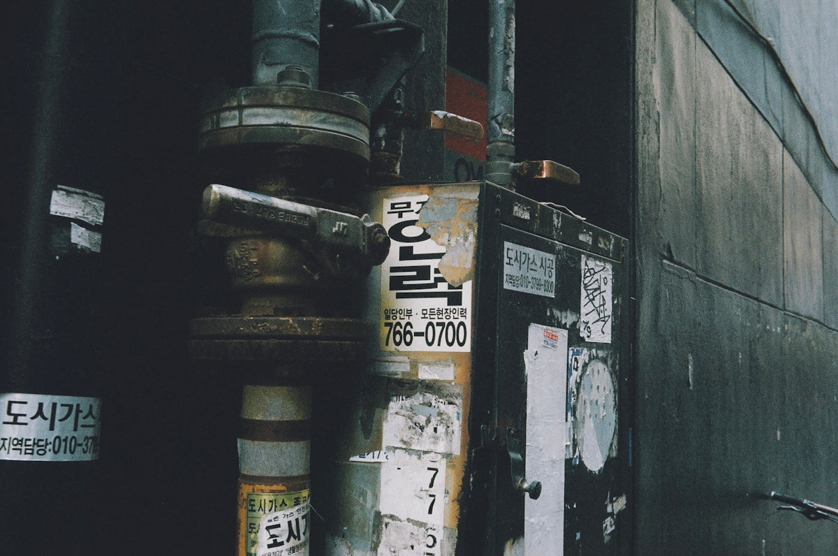 a fire hydrant sitting on the side of a building