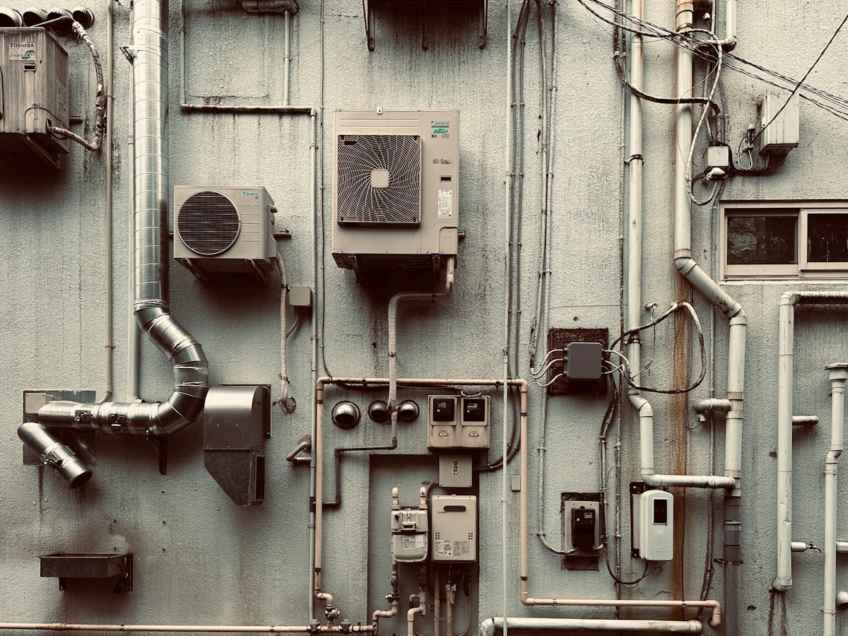 a large industrial building with a lot of pipes