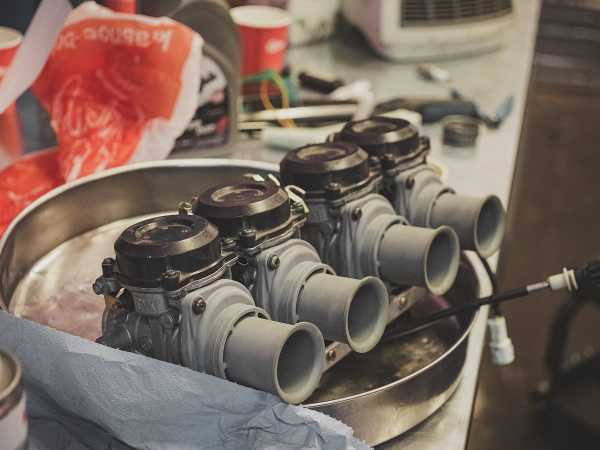 a group of engines sitting on top of a metal pan