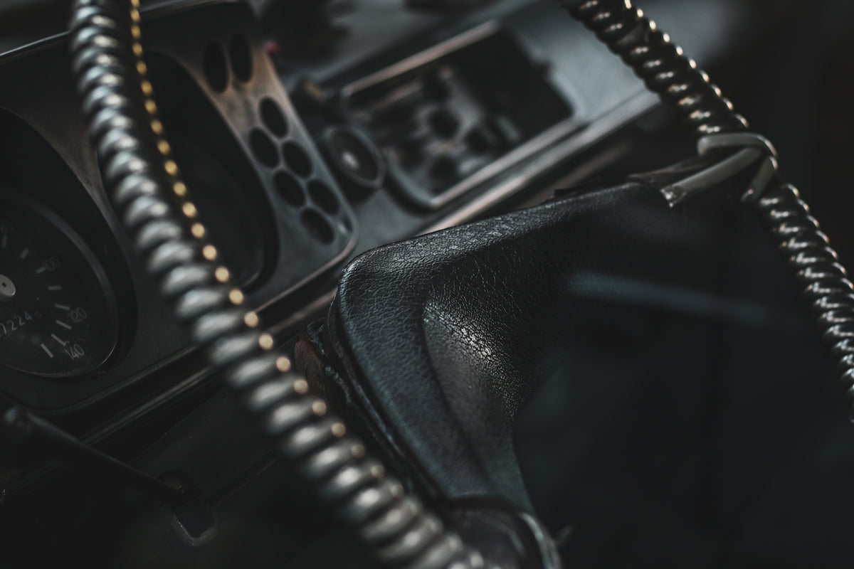 a close up of a car dashboard with a clock