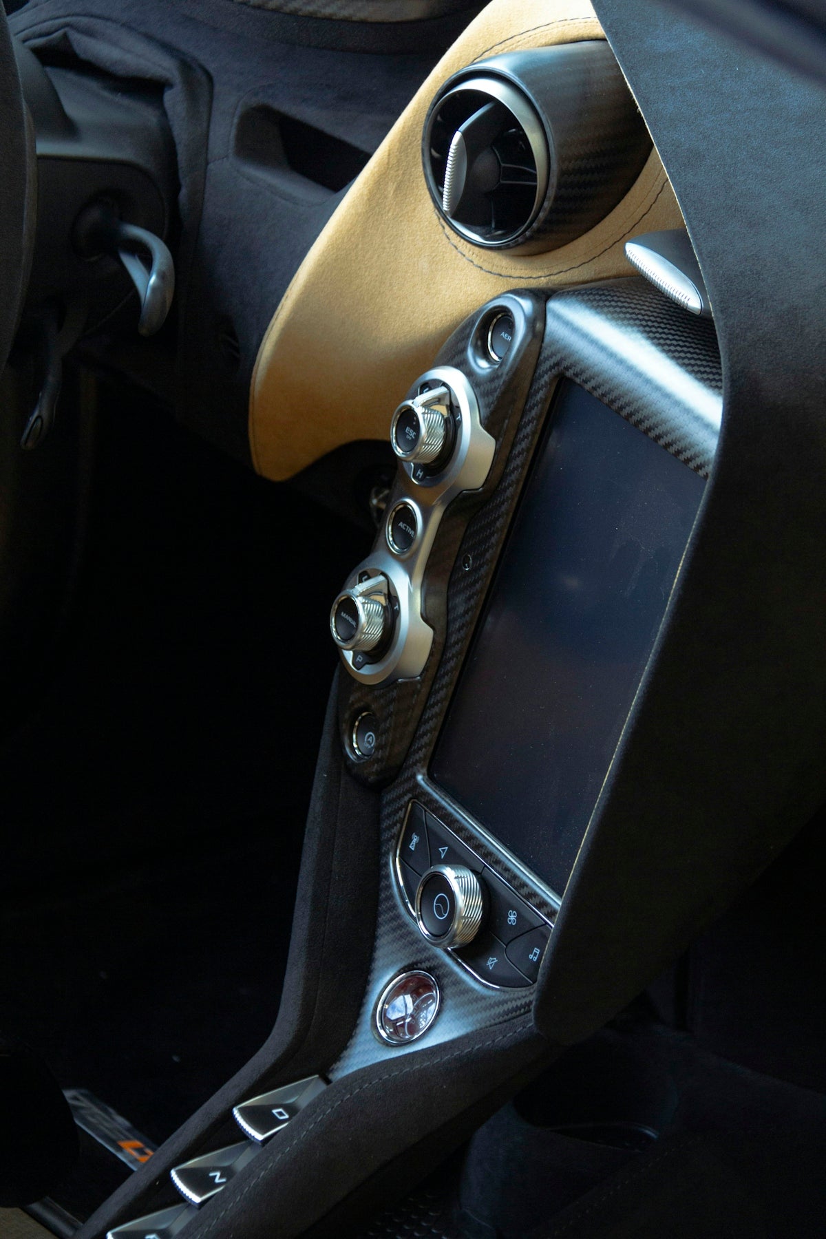 a close up of a car dashboard with a steering wheel