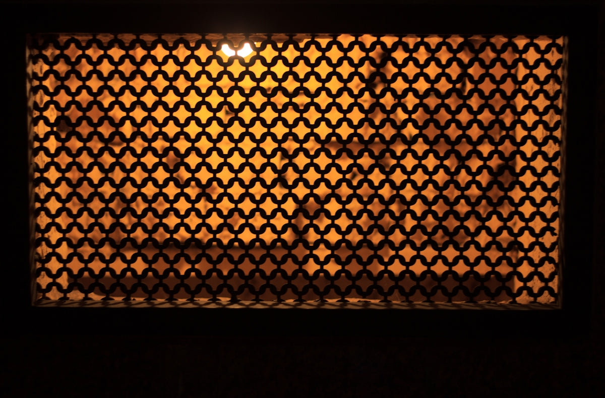 a view of a room through a latticed window