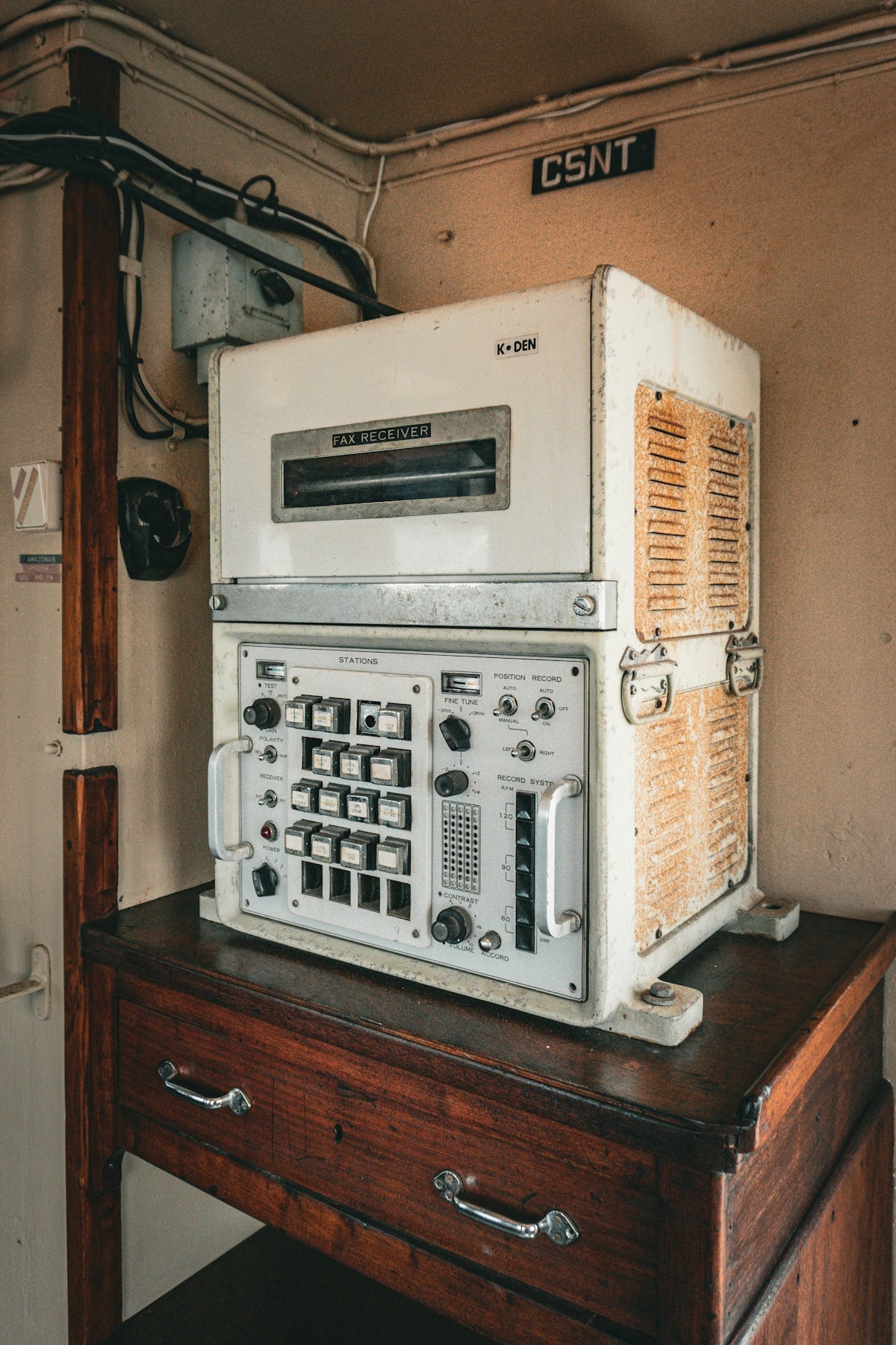 A white microwave sitting on top of a wooden table