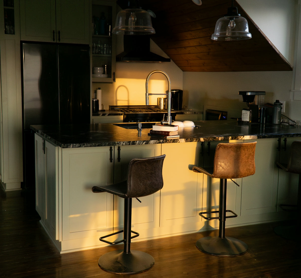 A couple of stools that are in a kitchen