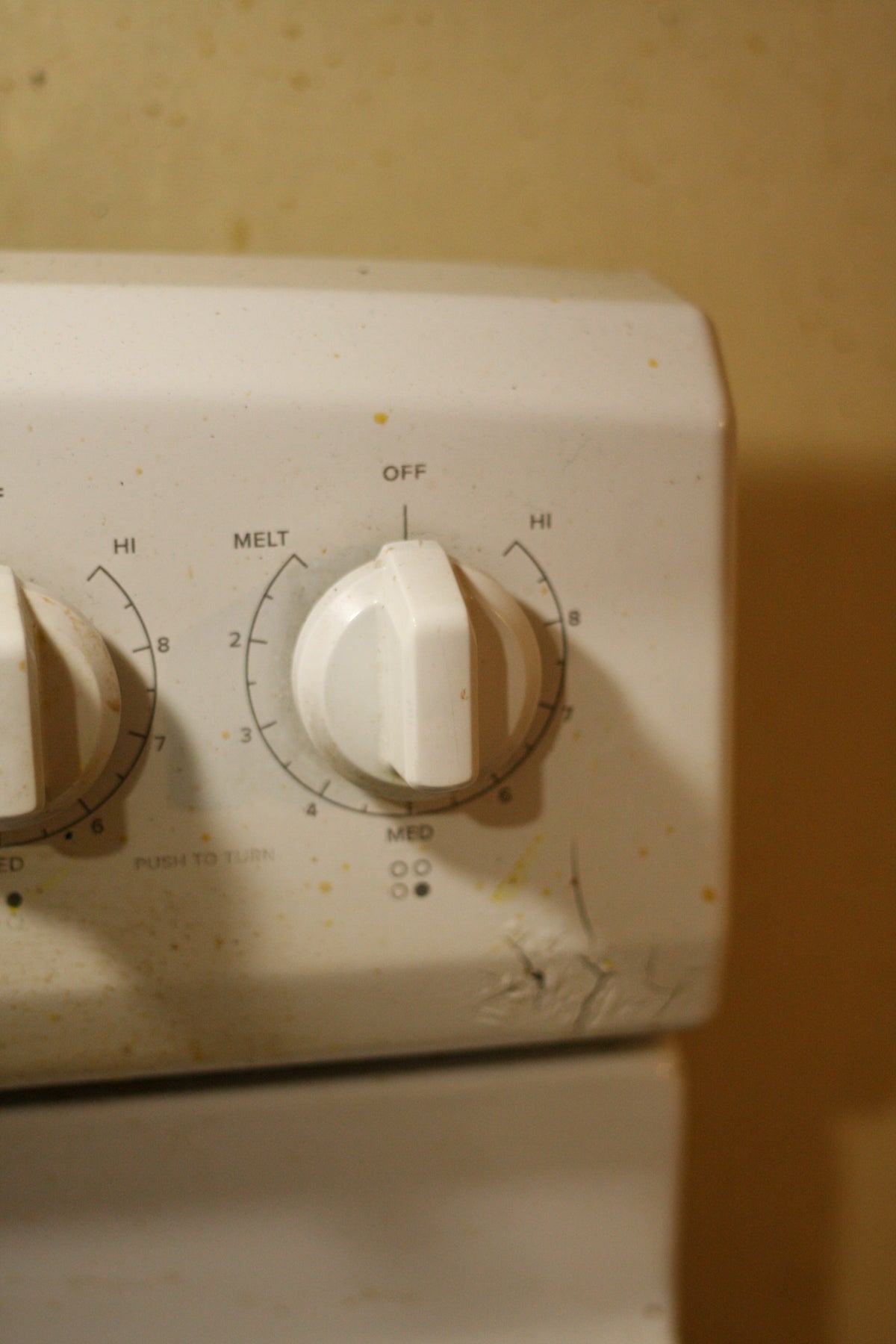 A close up of a white stove top oven