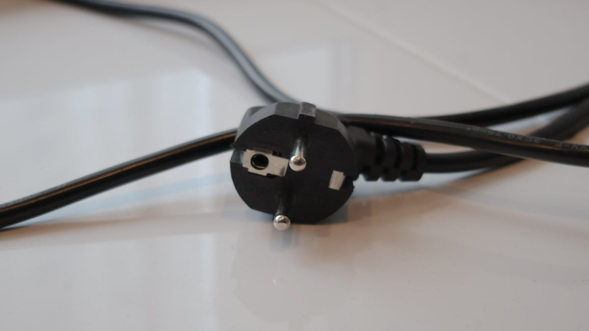A close up of a power cord on a table