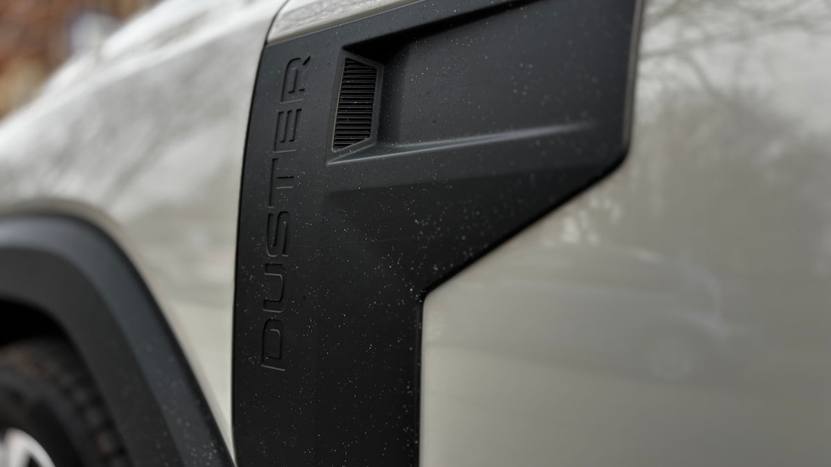 The side of a duster car is visible.
