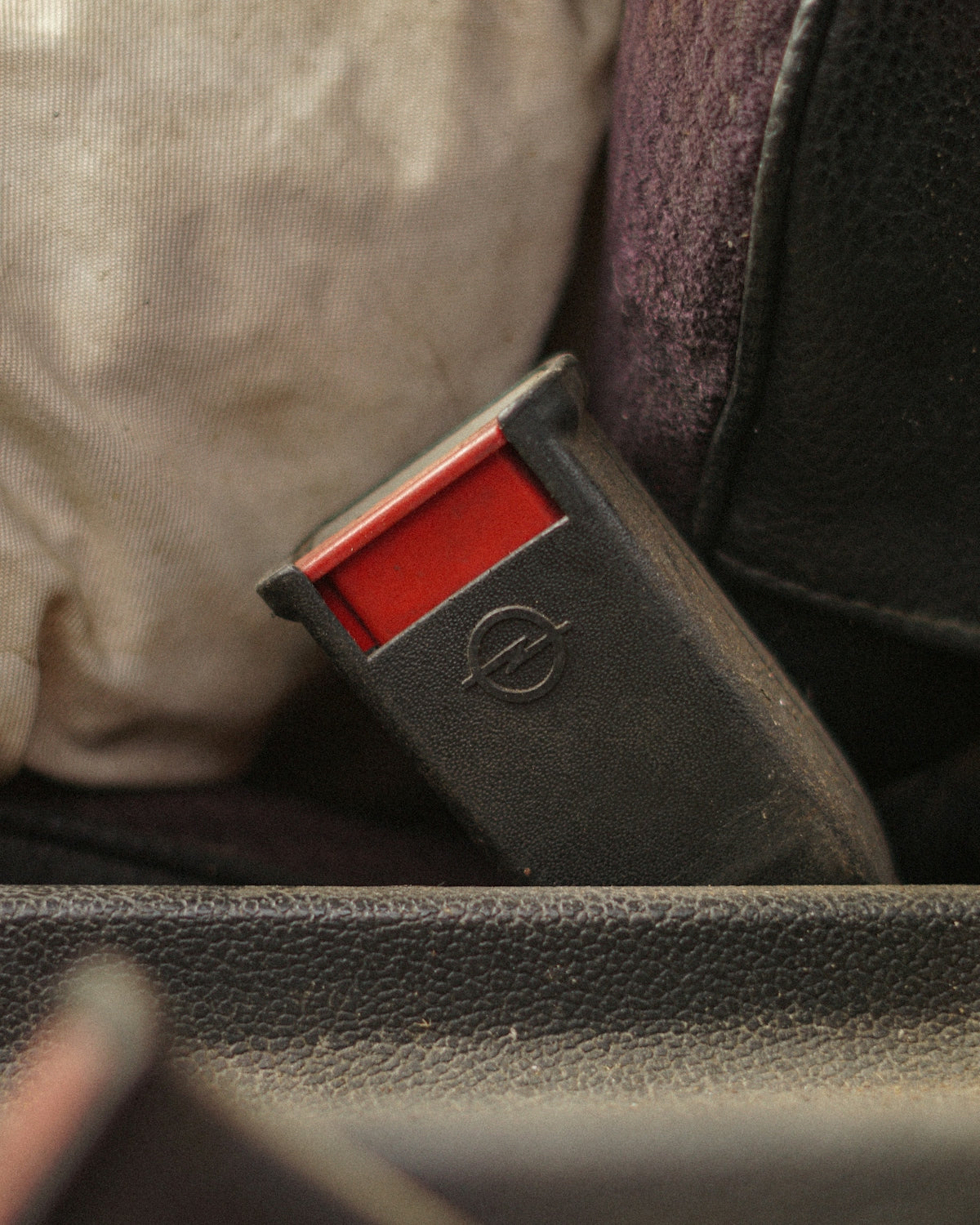 Close up of a car seatbelt buckle.