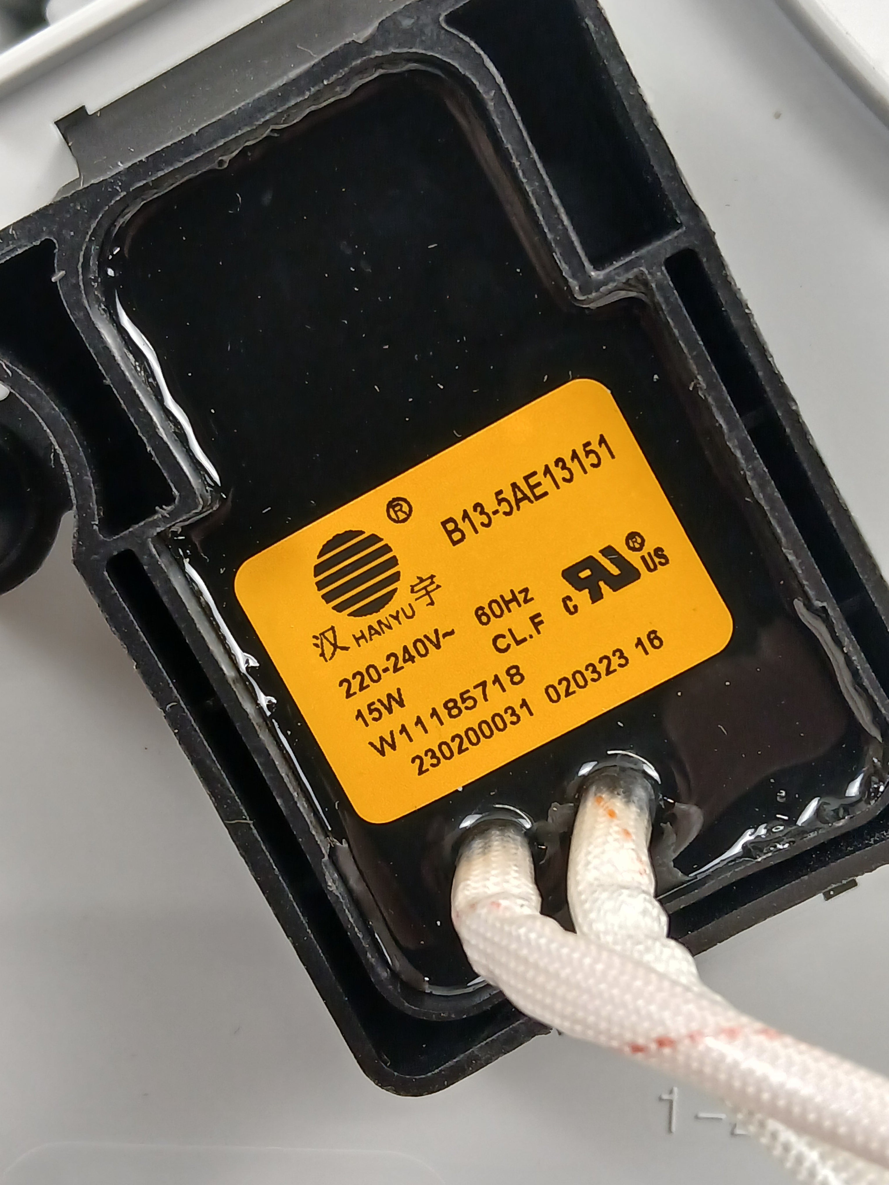 Close-up of XPart Supply W11516811 dryer drain pump replacement part with wiring and label